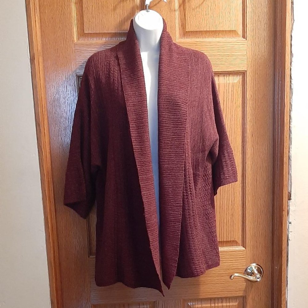 Raglan sleeve knit cardigan in rust color.